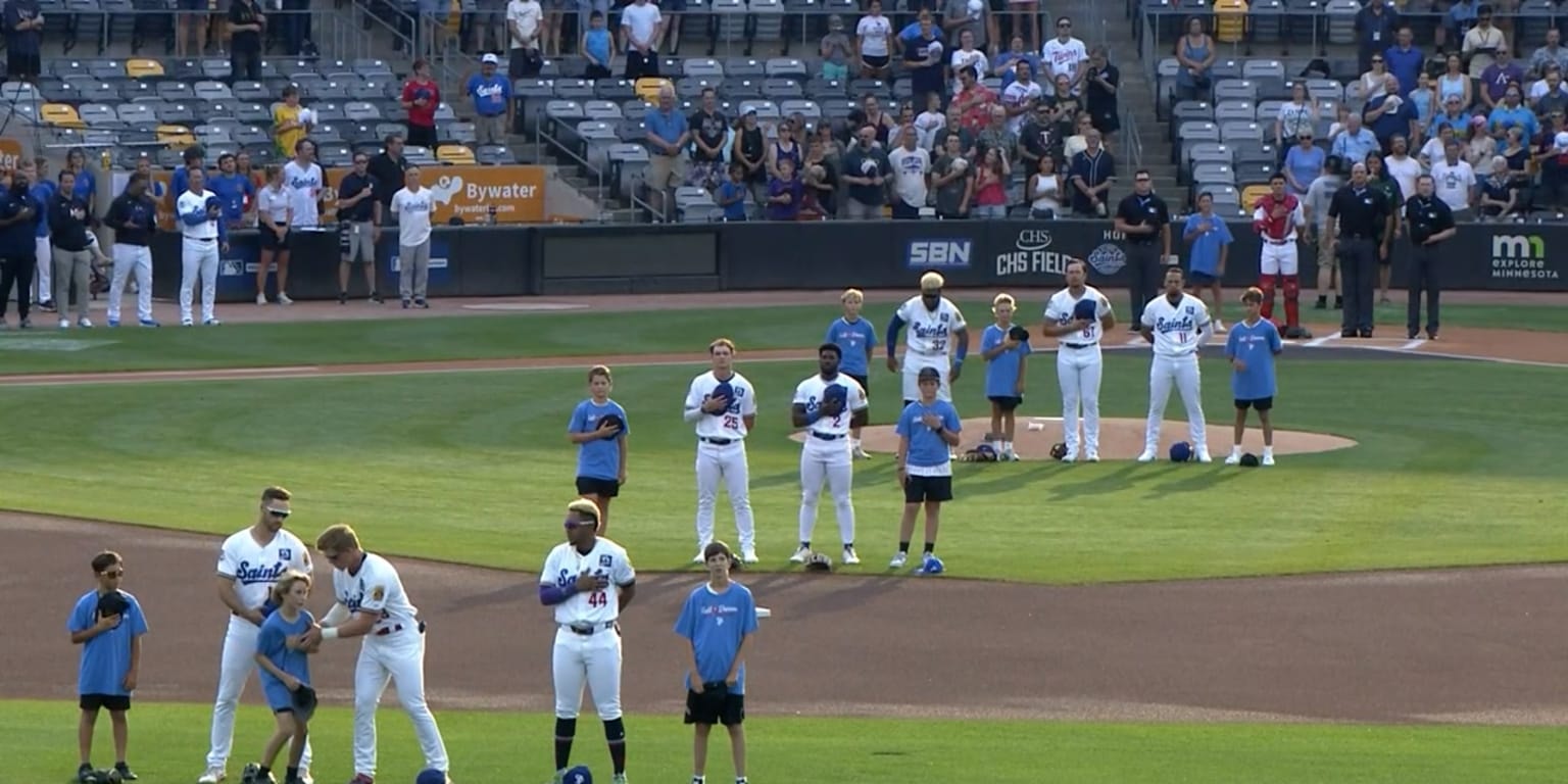 Walker Jenkins, the Twins’ top prospect dubbed “Captain America,” helps during a fainting incident