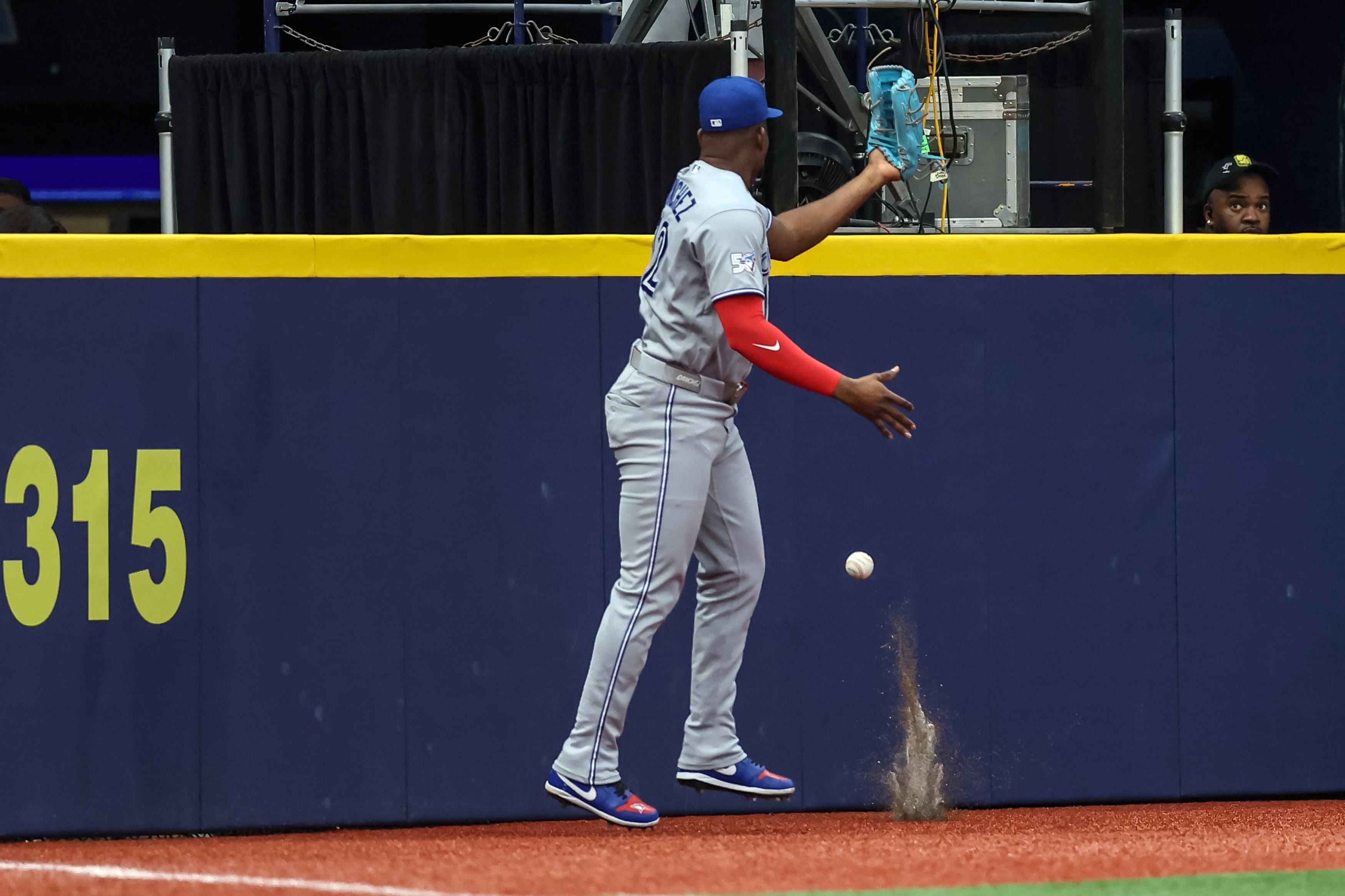 Rays edge Blue Jays 7-6 after two tricky left-field fly balls turn the game