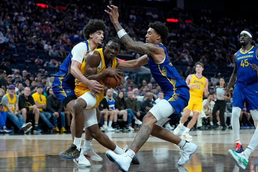 Adou Thiero leans into a leadership role next to Lakers rookie Cameron Carr in Summer League