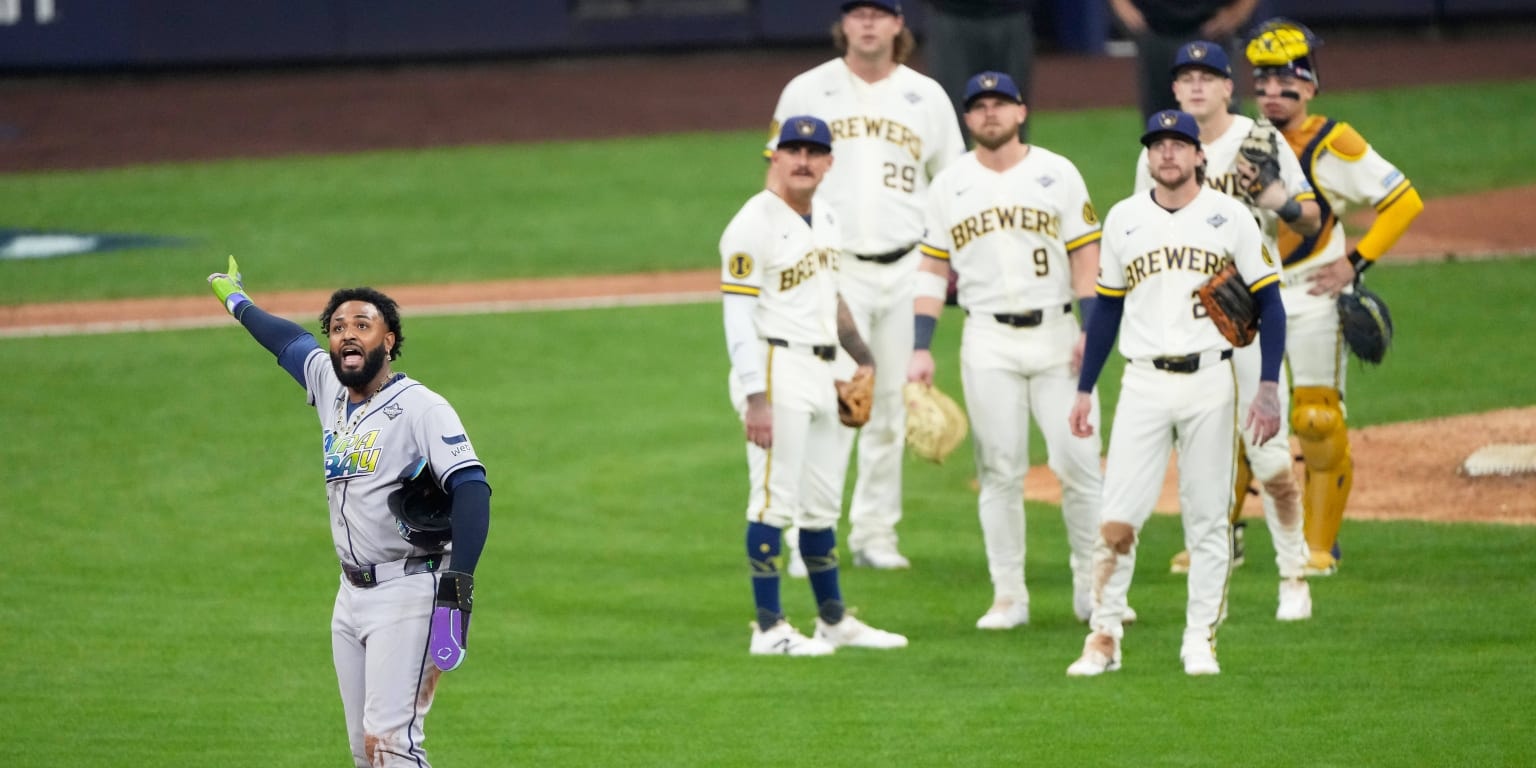 Replay overturns a 9th-inning double play, letting Milwaukee finish Game 1