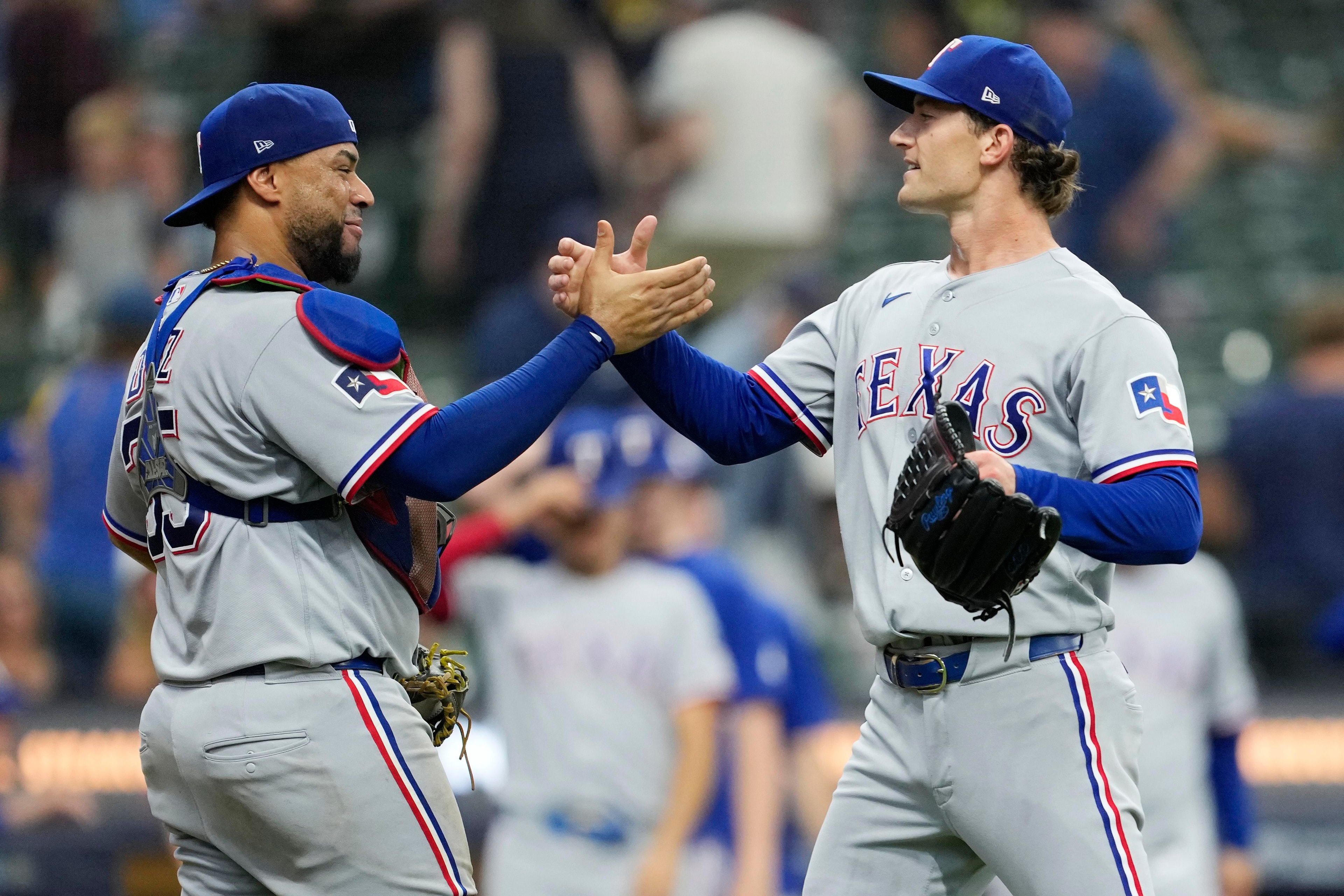 Rangers rally past Brewers 7-4 as Texas closes the door late