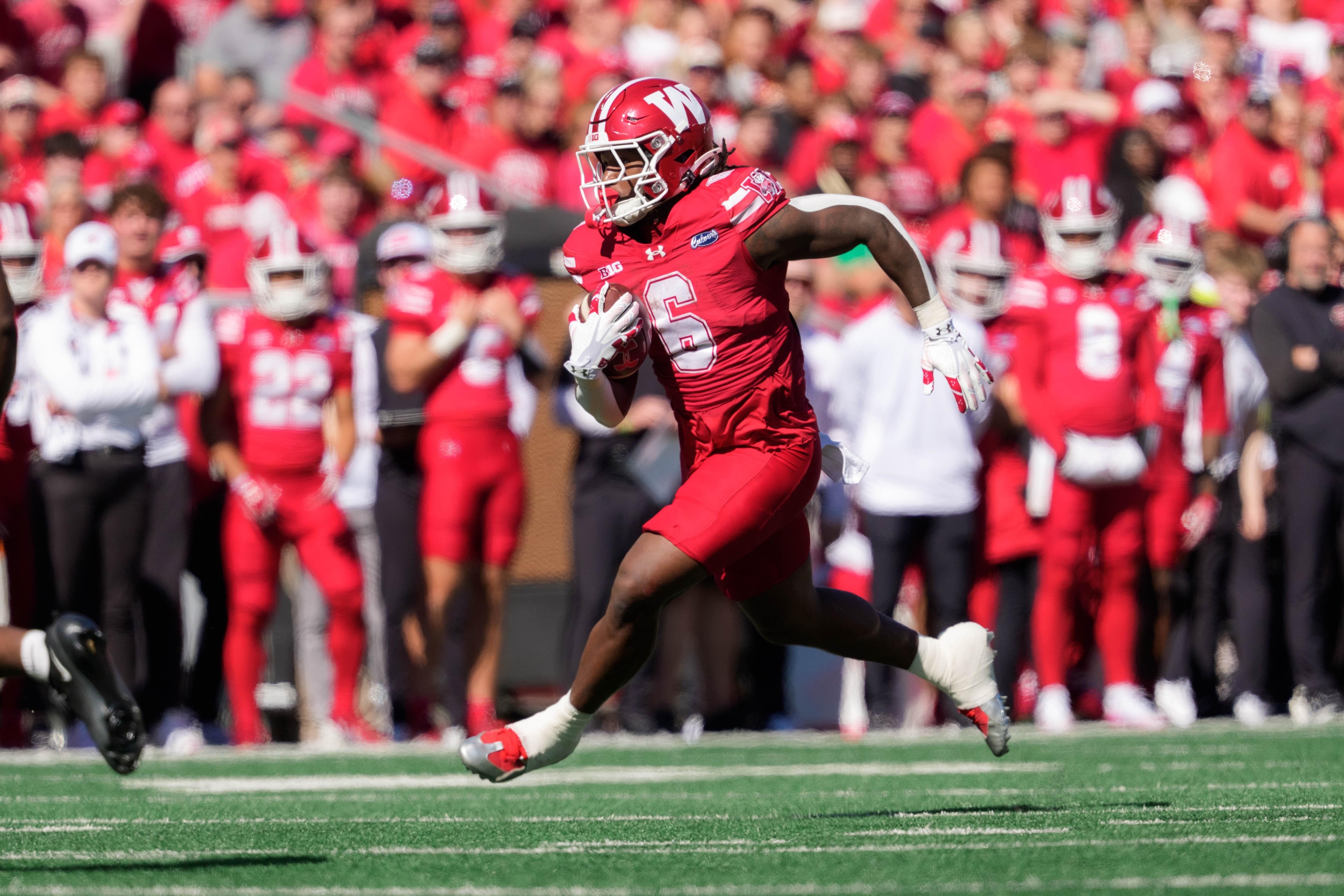 Wisconsin opens as a slight underdog against undefeated UCLA after QB injury