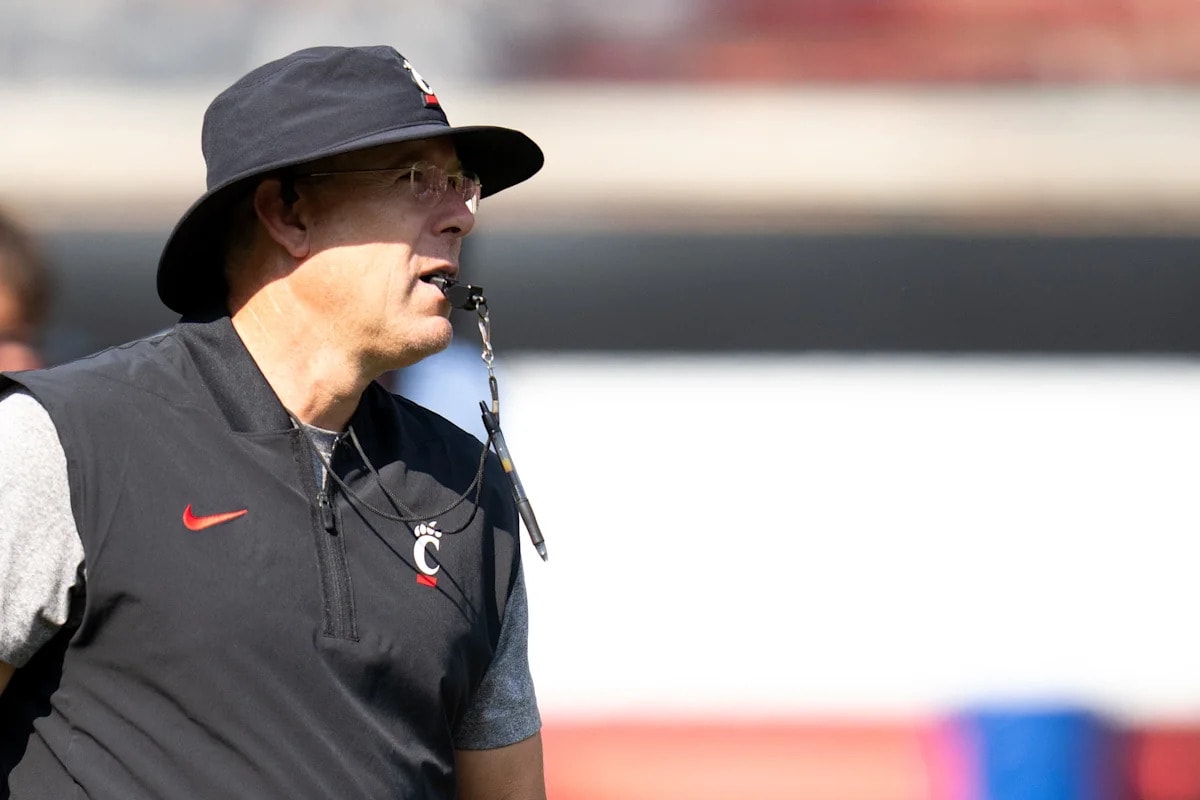 Report lists Cincinnati’s Scott Satterfield and former UC coach Luke Fickell among college football’s “hot seats” for 2026