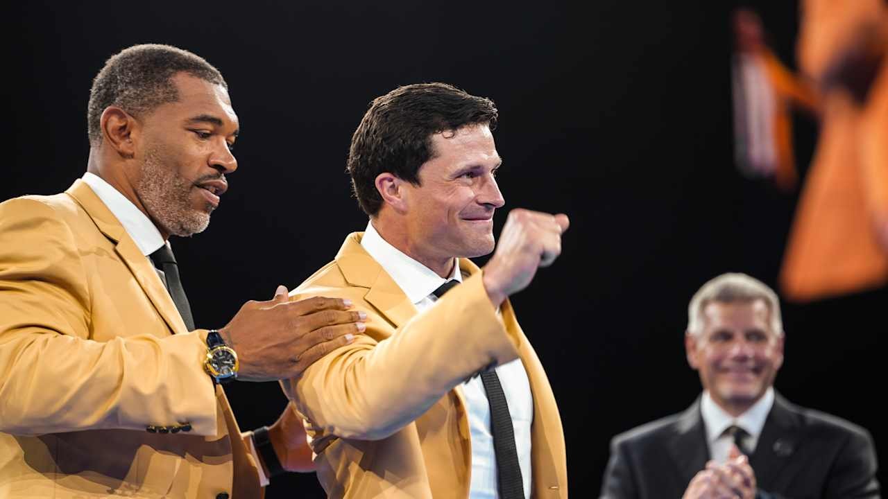 Luke Kuechly’s gold jacket ceremony comes full circle as Julius Peppers joins the Panthers family